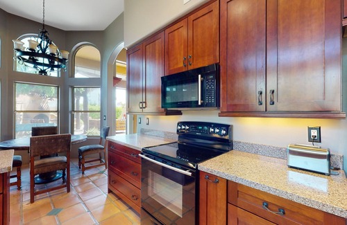 La Paz At Desert Springs House | Pueblo-style home with private pool, patio, lovely yard, kiva fireplace, firepit