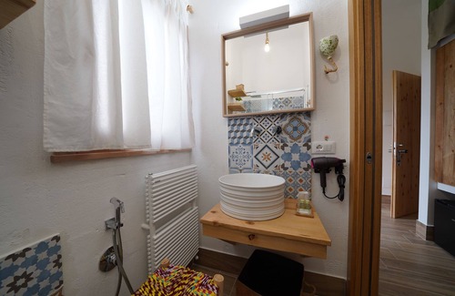 Pulsano Bed & Breakfast | Pumo room symbolizing fertility, abundance and prosperity