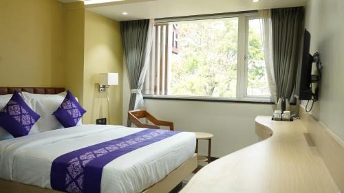 Surat Hotel | Purple Beds by VITS Dwarkesh, Surat