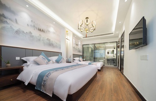 Fenghuang Hotel | Qixin Xianting Hotel