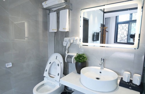 Fenghuang Hotel | Qixin Xianting Hotel