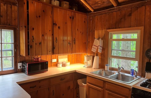 Harrison Cabin | Quaint and cozy log and knotty pine cabin close to lakes.