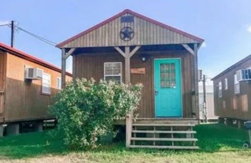 Matagorda Cabin | Quite peaceful cabin resort with pool and BBQ area with firepit!