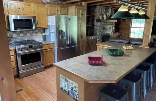 Bourbon Cabin | Real Log Cabin with Seasonal Pool and Hot Tub near Blue Springs Ranch