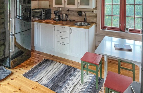 Nordre Land House | Recharge your batteries in this cozy log cabin near the Synna River.