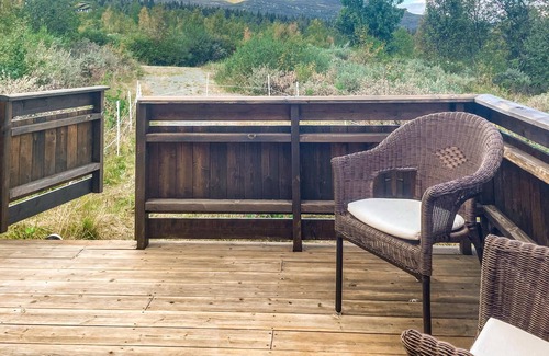 Nordre Land House | Recharge your batteries in this cozy log cabin near the Synna River.