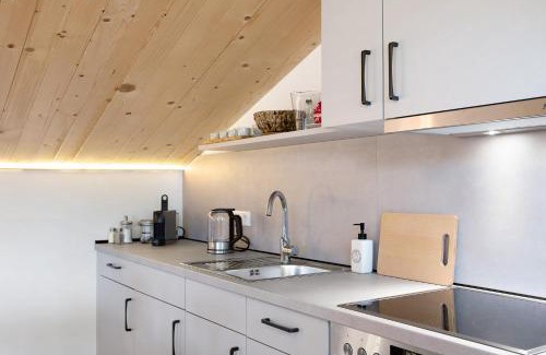 Schlitz Apartment | Refugium aus Vollholz
