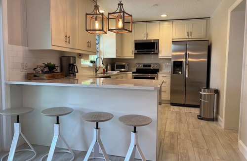 Redington Beach House | Relax and have some fun in this Salt water heated pool home, 5min walk to beachn