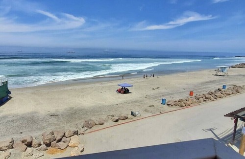 Mexicali Condo | Relaxed Spanish beachfront condo w/private parking & private balcony ocean views