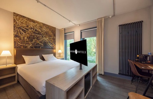Coevorden Hotel | Relish Modern Comforts in Historic Grain Warehouse Near Plopsa Indoor