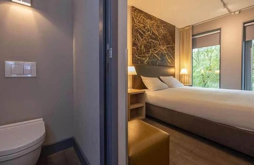 Coevorden Hotel | Relish Modern Comforts in Historic Grain Warehouse Near Plopsa Indoor