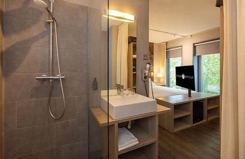 Coevorden Hotel | Relish Modern Comforts in Historic Grain Warehouse Near Plopsa Indoor