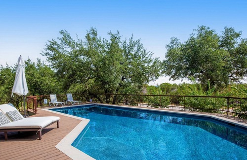 Barton Bend House | Remarkable villa with private pool, patio, game room, fireplace & gorgeous views