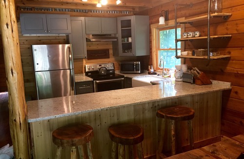 Waveland Cabin | Remodeled Log Cabin Surrounded By 6000 Acres and includes a Nordic Spa!