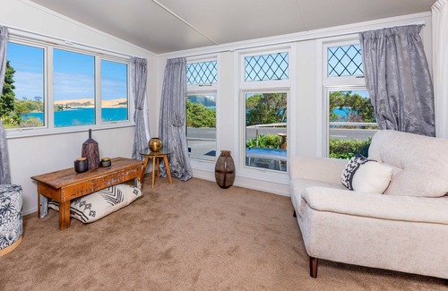 Opononi House | RENOVATED BEACH COTTAGE WITH HARBOUR AND SAND DUNE VIEWS.
