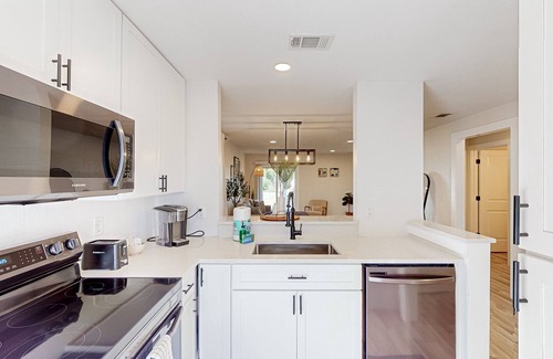 Bay Acres House | Renovated duplex near beach with central AC & private W/D-Dogs ok