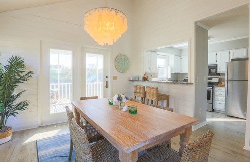 Pelican Bay House | Renovated Home w/Lagoon Views, Screened Porch, Deck & Community Pool; 5 Minute Walk to Beach!