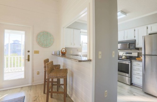 Pelican Bay House | Renovated Home w/Lagoon Views, Screened Porch, Deck & Community Pool; 5 Minute Walk to Beach!
