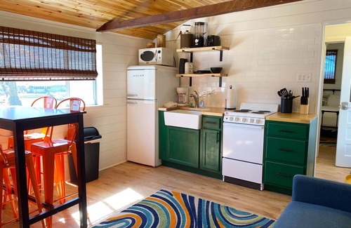 Camdenton Cabin | Renovated lakeside cabin with pool & resort amenities!