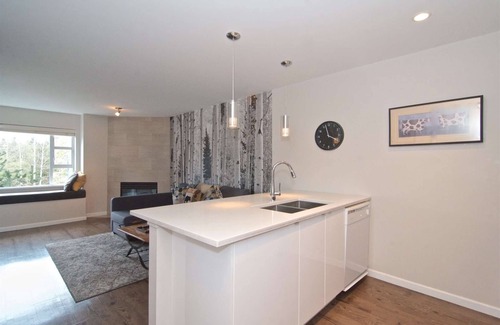 Village North Condo | Renovated, Village location. Walk to lifts and amenities, modern décor, Roof top hot tub in complex