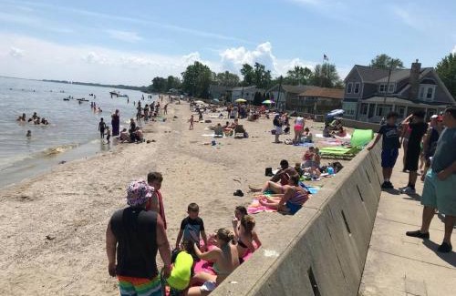 Luna Pier House | Restored historic log cabin & deck on Lake Erie