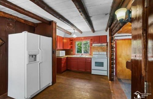 Luna Pier House | Restored historic log cabin & deck on Lake Erie