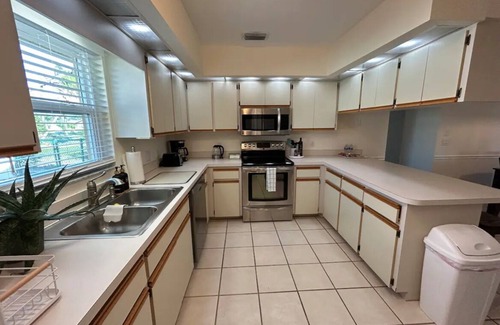 Pebble Beach House | Retreat with Screened Heated Pool Overlooking the Golf Course 3BR/2BA