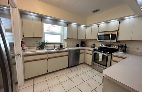 Pebble Beach House | Retreat with Screened Heated Pool Overlooking the Golf Course 3BR/2BA