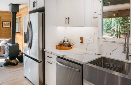 Baring Cabin | Riverfront A-Frame w/Hot Tub Near Stevens Pass Pet-Friendly Retreat