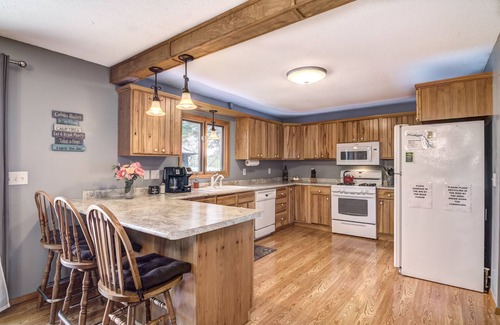 Amery House | Riverfront cabin with kayaks and canoes