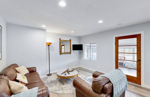 Post Falls House | Riverfront charmer with sunroom, gas grill, games, smart TVs, W/D, & partial AC