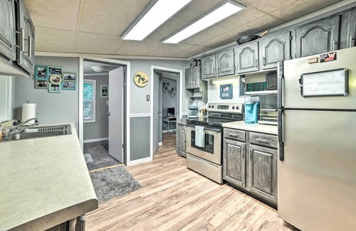 Cheboygan Cottage | Riverfront Home w/Dock ~ 6 Mi to Cheboygan!