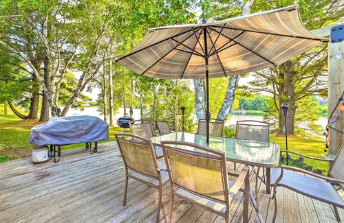 Cheboygan Cottage | Riverfront Home w/Dock ~ 6 Mi to Cheboygan!