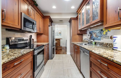Bayshore Gardens House | Riverfront home with screened private pool, outdoor kitchen, & water access