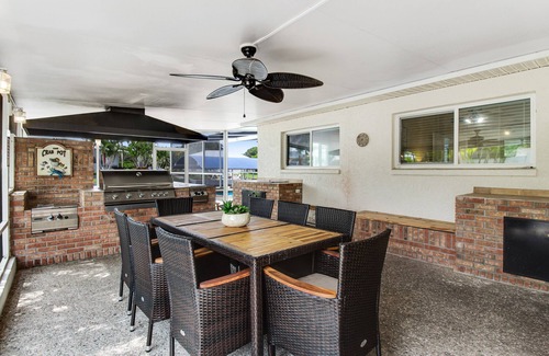 Bayshore Gardens House | Riverfront home with screened private pool, outdoor kitchen, & water access