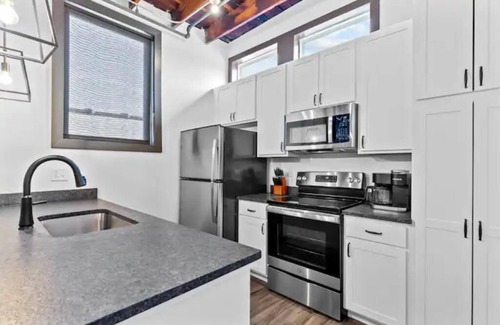Downtown St. Louis Apartment | Riverfront Loft - Private Balcony - King Bed - Arch, Conventions & Casino