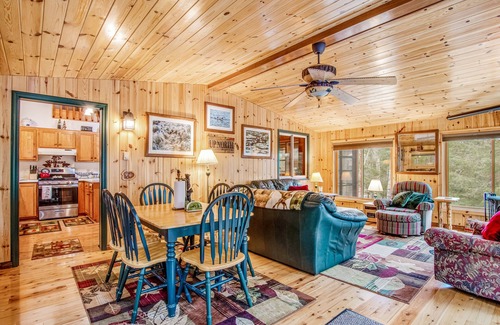 Lac du Flambeau Cabin | Riverfront vacation home with a dock, wood stove, full kitchen, & firepit