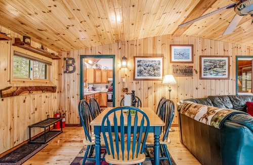 Lac du Flambeau Cabin | Riverfront vacation home with a dock, wood stove, full kitchen, & firepit