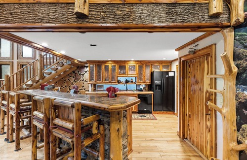 Ellijay Cabin | Riverside Luxury: Hot Tub, Fire Pit & Fishing Dock! Game Room, Fireplace!