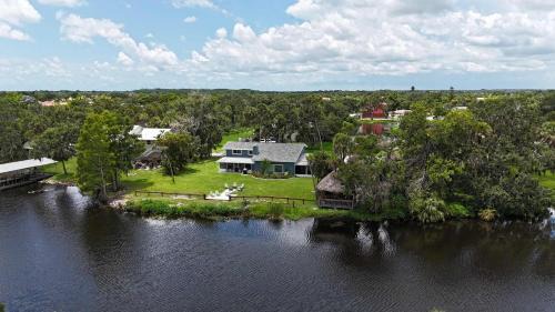 Braden River House | Riverside Oasis Home w Tiki Hut & Firepit