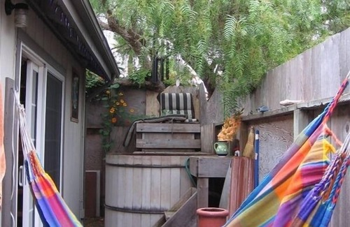 Opal Cliffs House | Romantic Retreat. Soak in the hot tub or lie on loft bed; listen to the surf.