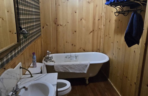 Buckinghorse River Cabin | Room 5 at the Main Lodge with a queen bed and single bed.
