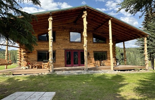 Buckinghorse River Cabin | Room 5 at the Main Lodge with a queen bed and single bed.