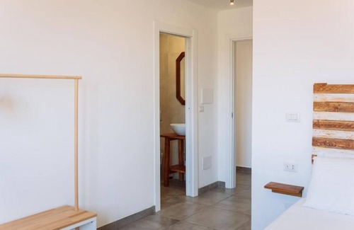 Porto Torres Apartment | Room Olivo - Full service room with private bathroom