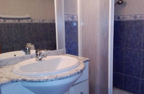 Porto Covo House | Room 'Quarto 8' in Porto Covo with a Fan