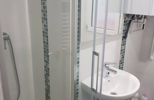 Castro Urdiales Condo | Round shared room