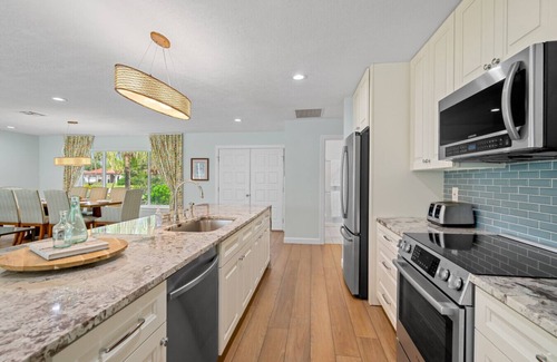 Kings Lake House | Rovigo Vacation Rental: Spacious Retreat with Panoramic Lake Views in Kings Lake. 4-BR, 4-Bathroom Home with Private Pool and just 3.4 Miles from the Vibrant 5th Ave and Naples Attractions!