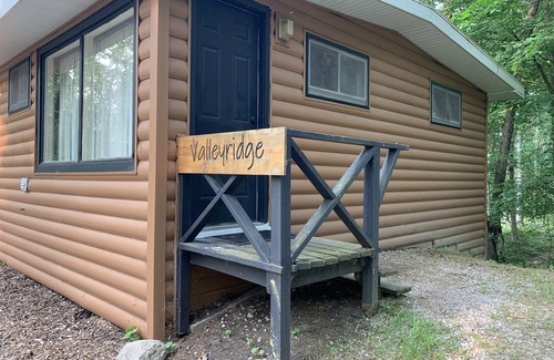 Palmyra Cabin | Rustic cabins in secluded campground with lake access and woods to wander in.