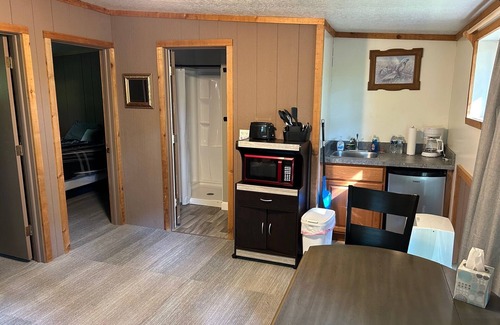 Palmyra Cottage | Rustic cabins in secluded campground with lake access and woods to wander in.