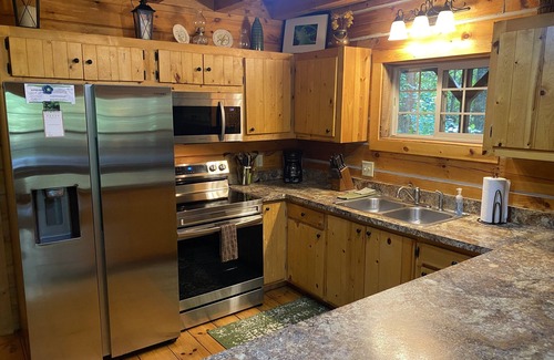 Logan Cabin | Rustic Getaway Cabin equipped with Hot Tub, trails on property, private!